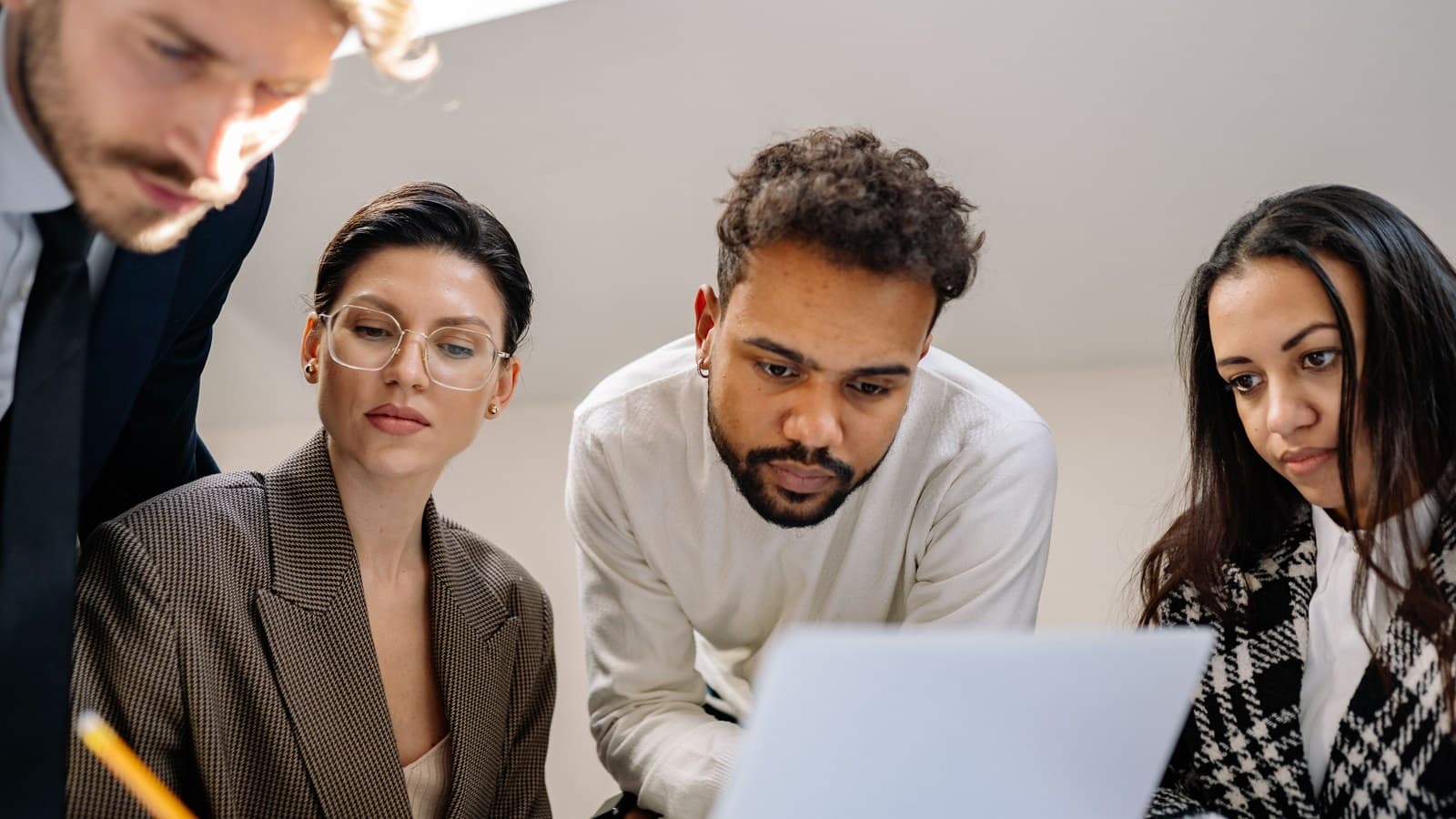 A strategy team works together around a shared table